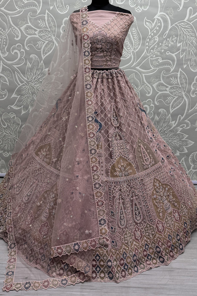 Beautiful Peach Sequins Net Engagement Wear Lehenga Choli