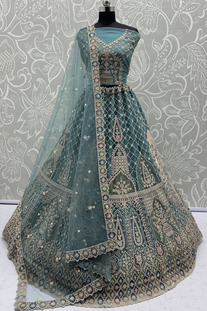 Magnetic Blue Zari Embroidered Net Engagement Wear Lehenga Choli With Dupatta