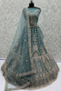 Magnetic Blue Zari Embroidered Net Engagement Wear Lehenga Choli With Dupatta