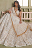 Shocking Off-White Embroidered Net Wedding Wear Lehenga Choli