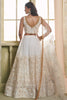 Shocking Off-White Embroidered Net Wedding Wear Lehenga Choli