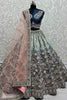 Marvelous Teal Blue Embroidered Velvet Bridal Lehenga Choli