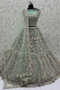Bewitching Pista Green Sequins Net Designer Lehenga Choli