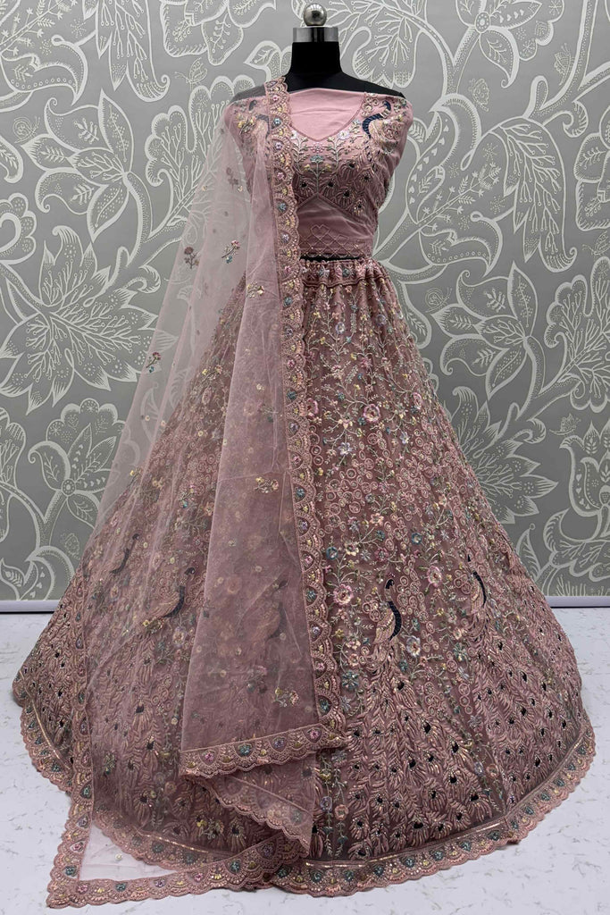 Tantalizing Peach Sequins Net Engagement Wear Lehenga Choli
