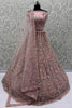 Tantalizing Peach Sequins Net Engagement Wear Lehenga Choli
