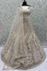 Attractive White Zari Embroidered Net Reception Wear Lehenga Choli 