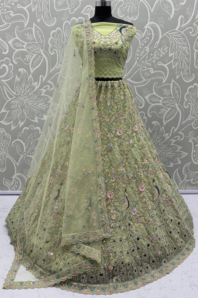 Precious Pista Green Zircon Work Net Engagement Wear Lehenga Choli With Dupatta