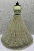 Precious Pista Green Zircon Work Net Engagement Wear Lehenga Choli With Dupatta