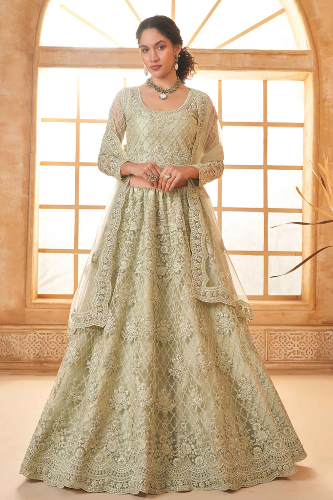 Bewitching Pista Green Stone Work Net Function Wear Lehenga Choli