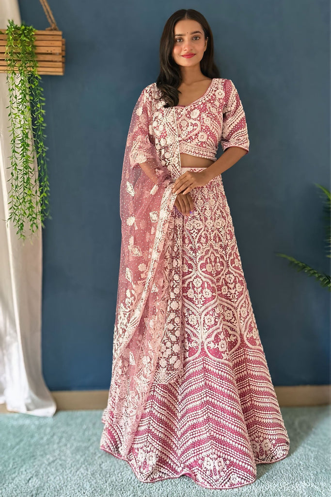 Glamorous Pink Embroidered Net Wedding Wear Lehenga Choli With Dupatta
