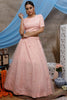 Fascinating Peach Net Party Wear Lehenga Choli With Jacket