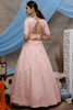 Fascinating Peach Net Party Wear Lehenga Choli With Jacket