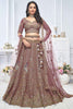 Endearing Purple Embroidered Net Reception Wear Lehenga Choli