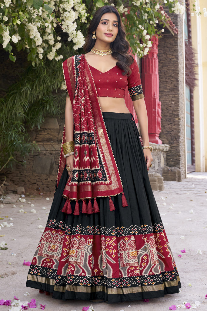 Astonishing Black Patola Printed Tussar Silk Event Wear Lehenga Choli