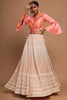 Marvelous Peach Lucknowi Work Net Festival Wear Crop Top Lehenga