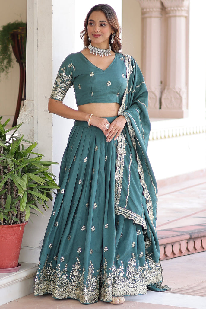 Outstanding Teal Green Zari Embroidered Silk Engagement Wear Lehenga Choli