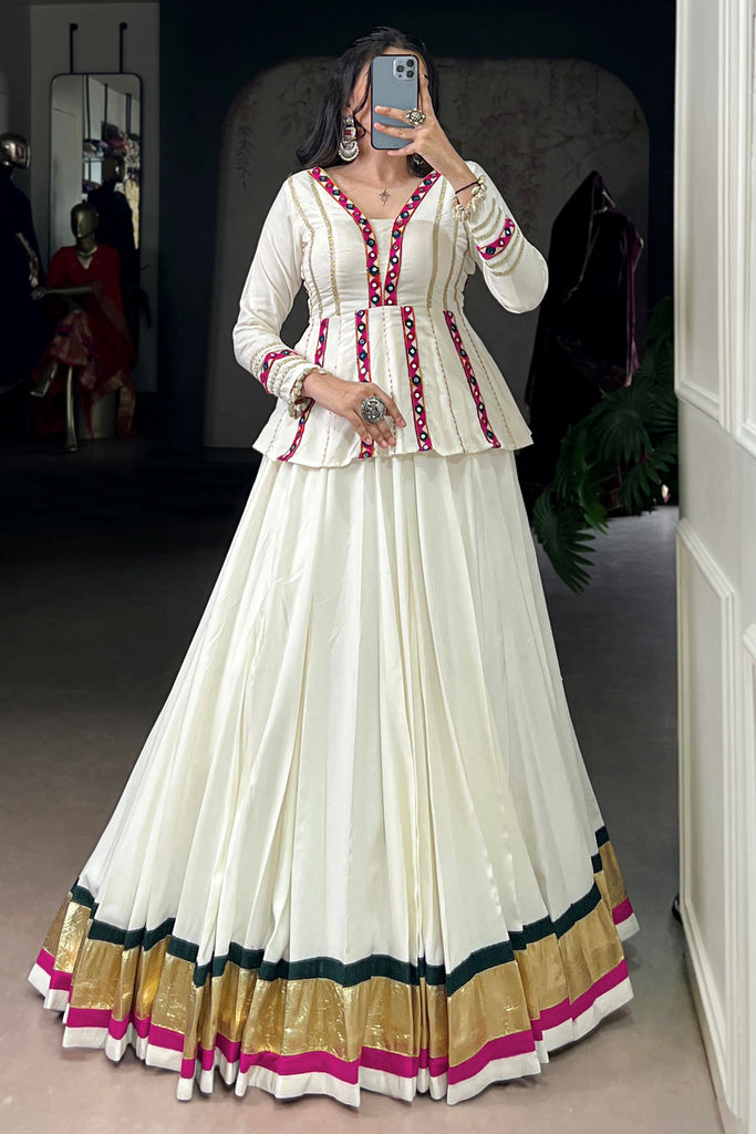 Fascinating White Rayon Navratri Lehenga With Mirror Work Peplum Top