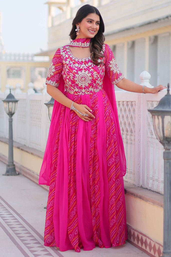 Tantalizing Rani Pink Bandhej Print Georgette Gown With Dupatta