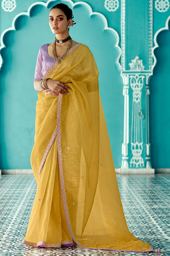 Endearing Yellow Heavy Border Work Tissue Silk Haldi Wear Saree