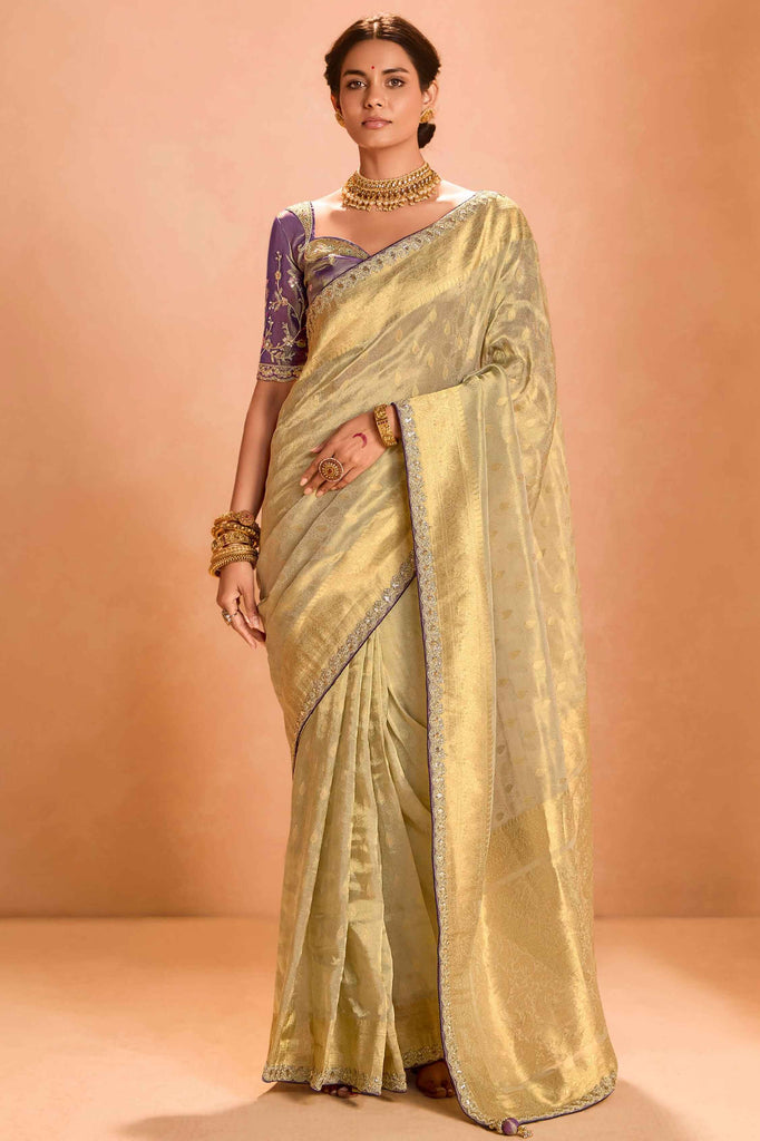 Shocking Ivory Color Zari Weaving Silk Festival Wear Saree With Blouse