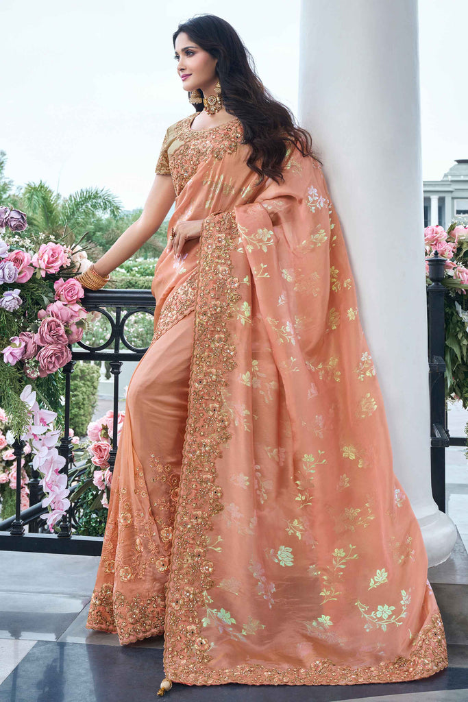 Striking Peach Zari Woven Organza Silk Function Wear Saree With Blouse