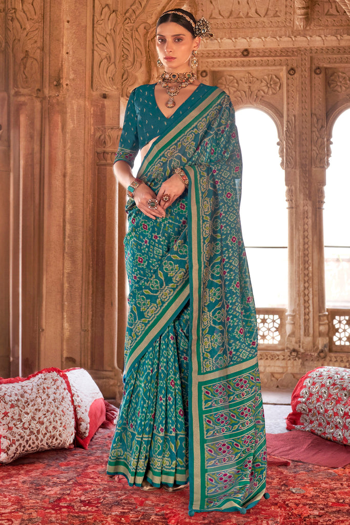 Exquisite Teal Green Patola Printed Georgette Casual Wear Saree