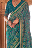 Exquisite Teal Green Patola Printed Georgette Casual Wear Saree