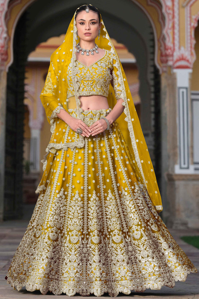 Alluring Yellow Embroidered Net Haldi Wear Lehenga Choli With Dupatta