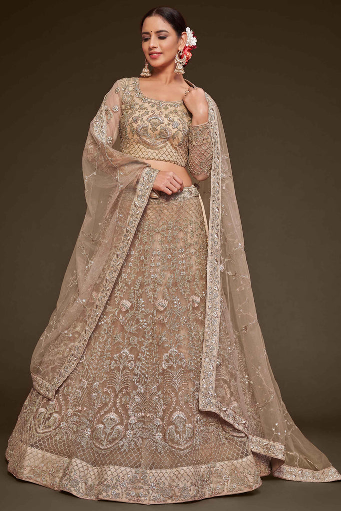 Winsome Beige Embroidered Soft Net Engagement Wear Lehenga Choli