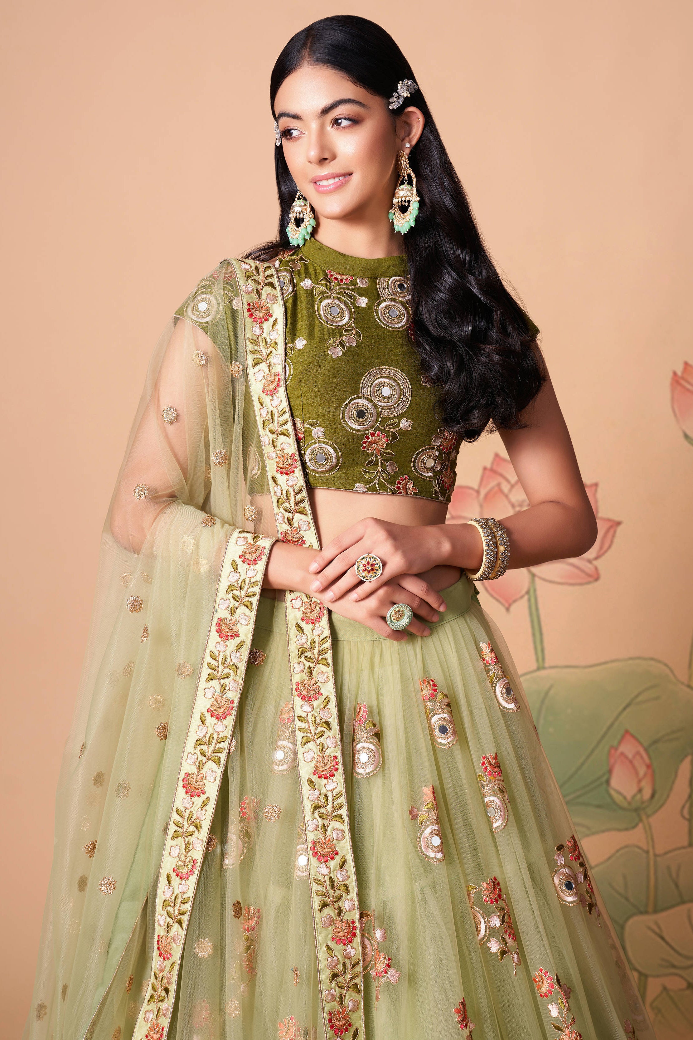 The pista green color net dupatta comes prettified with thread embroidery and sequin work.