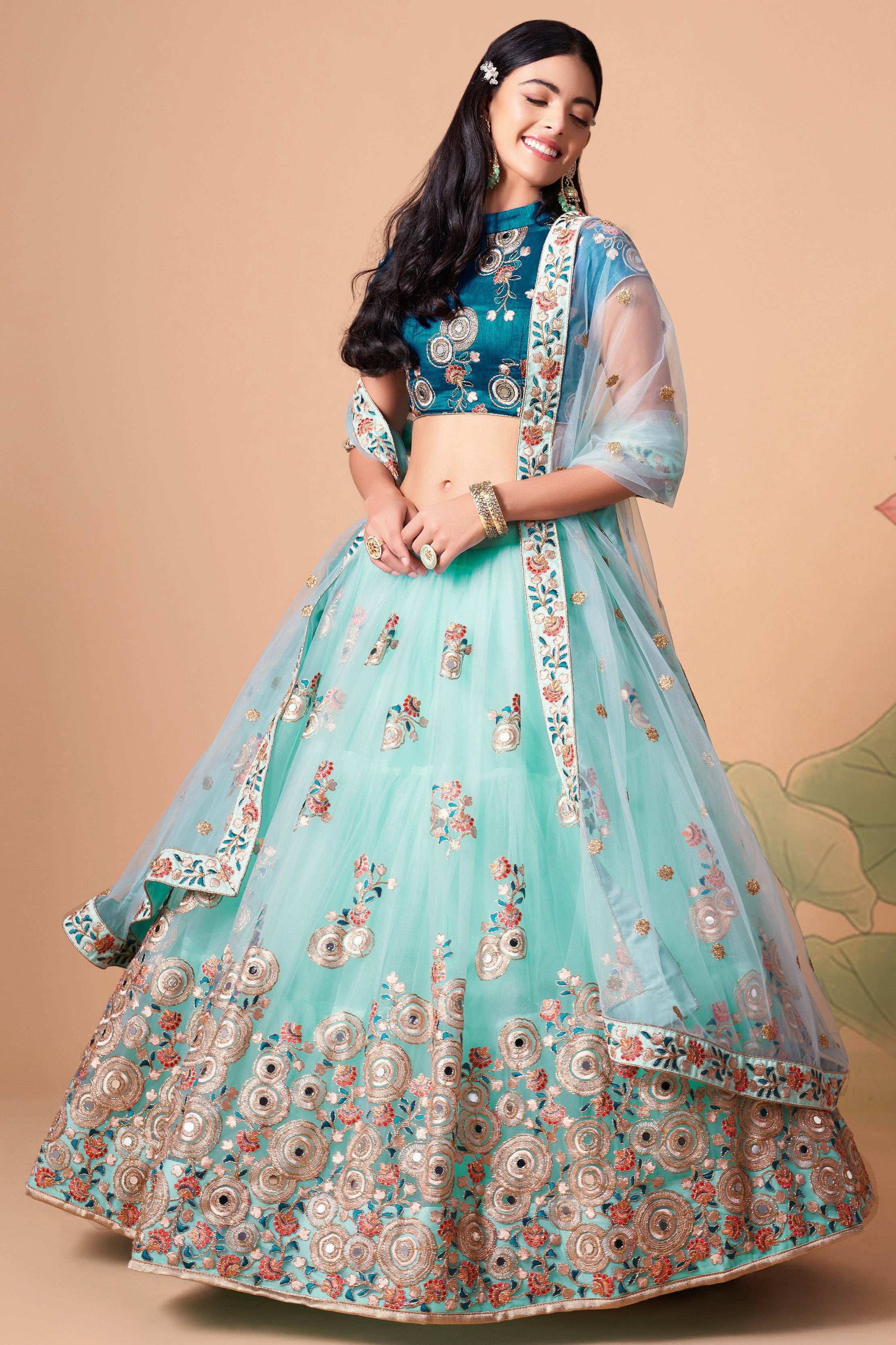 The sky blue color net dupatta comes prettified with thread embroidery and sequin work.