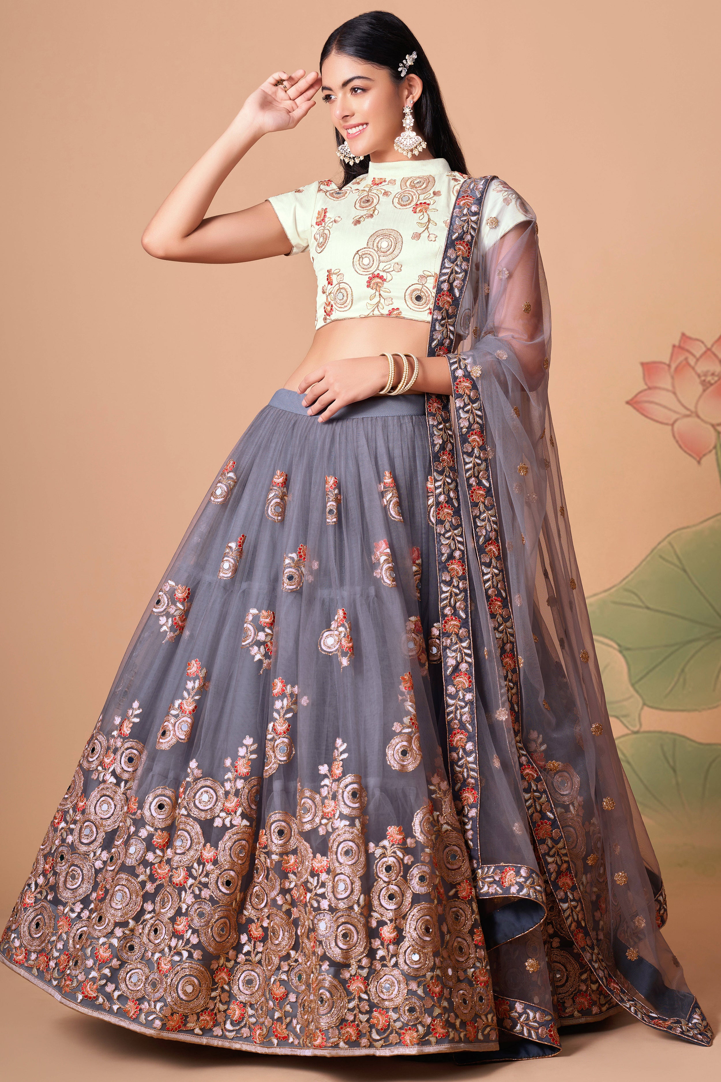 The grey color net dupatta comes prettified with thread embroidery and sequin work.