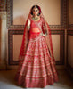 Breathtaking Red Colored Bridal wear Embroidered Lehenga Choli